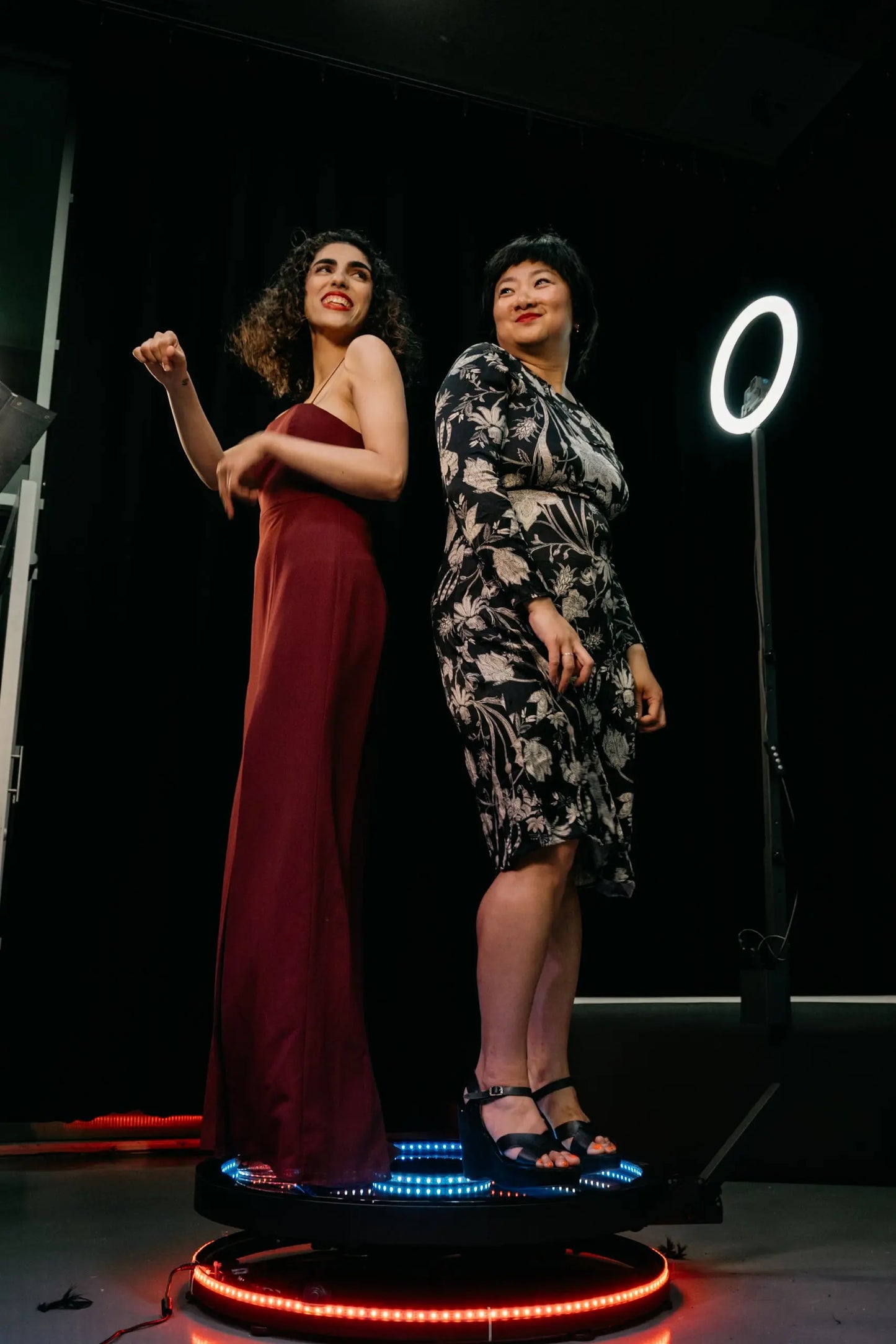 Guests posing with 360 Photobooth as it spins around them